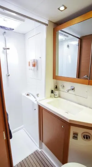 Great Adventure Yacht Photos Pics 2014 Lagoon 450 yacht bathroom with shower, sink, and mirror.