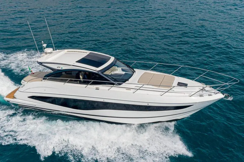  Yacht Photos Pics 2021 Princess V50 Open yacht cruising on the ocean, showcasing sleek design and luxury.