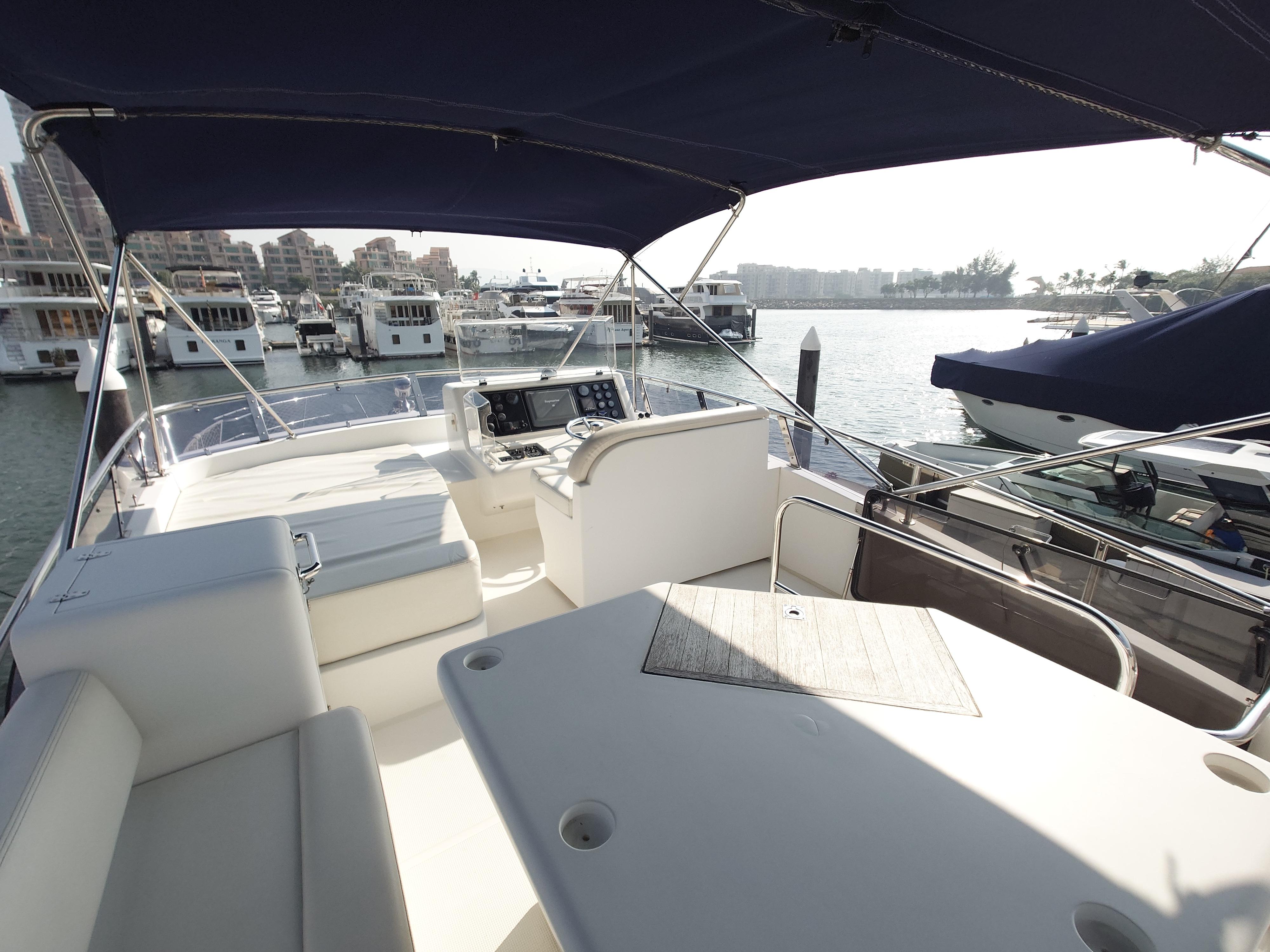Luxurious 2009 Ruby 52 yacht interior with spacious seating and marina view.