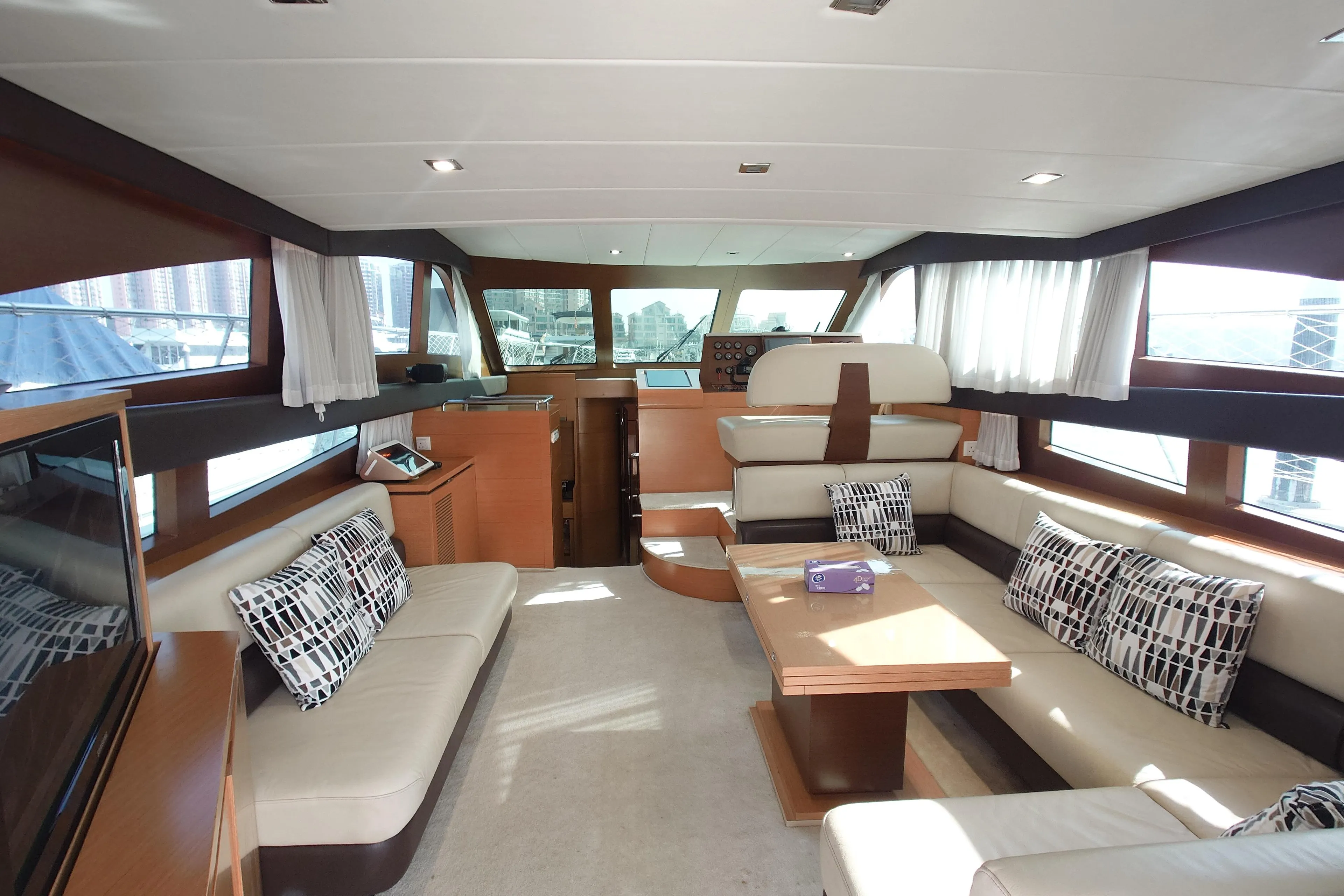 Luxurious interior of 2009 Ruby 52 yacht with plush seating and modern design.