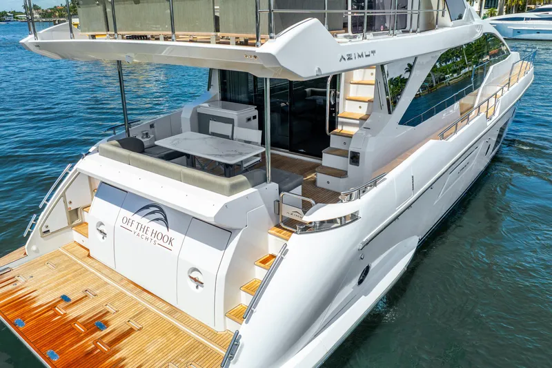  Yacht Photos Pics 2021 Azimut Fly 72 yacht with elegant deck and seating area on the water.