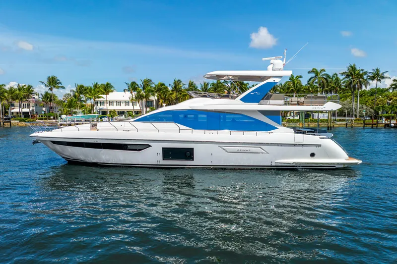  Yacht Photos Pics Azimut Fly 72 yacht, 2021 model, cruising on a sunny day with palm trees in the background.