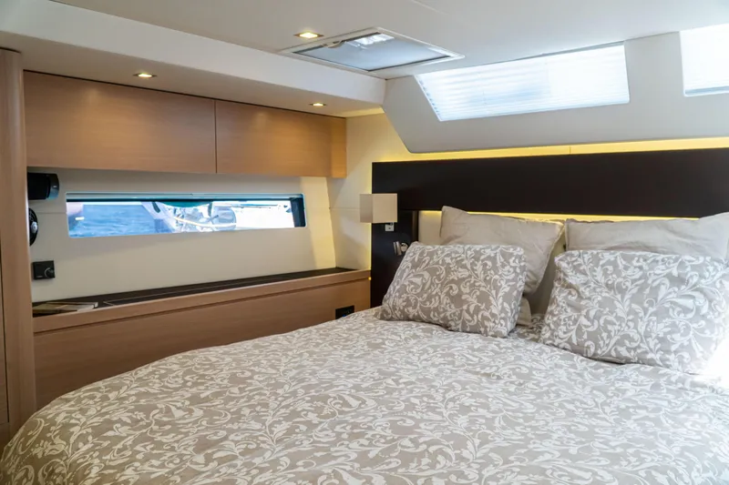  Yacht Photos Pics Luxurious cabin interior of 2018 Amel 50 yacht with elegant bedding and modern design.