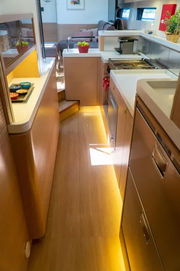  Yacht Photos Pics Modern kitchen interior of 2018 Amel 50 yacht with sleek design and ambient lighting.