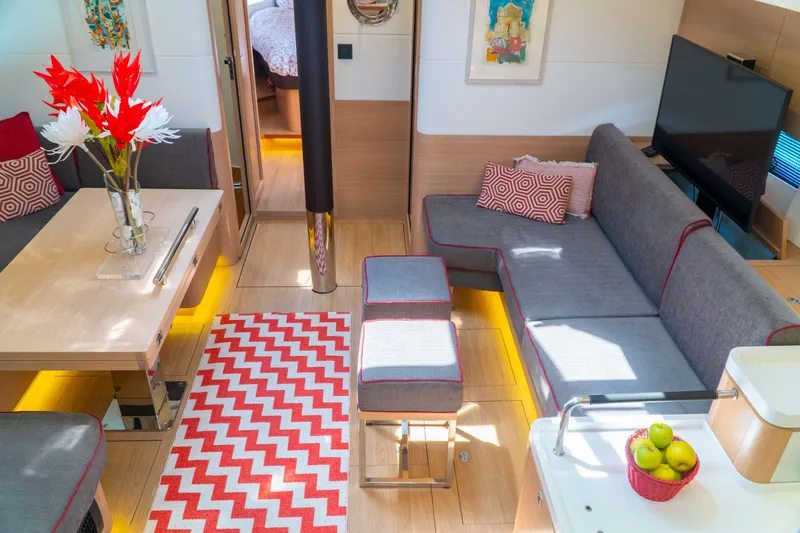  Yacht Photos Pics Luxurious interior of 2018 Amel 50 yacht with modern decor and vibrant accents.