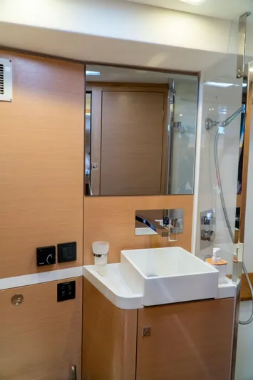  Yacht Photos Pics Modern bathroom interior on 2018 Amel 50 yacht with sink and shower.