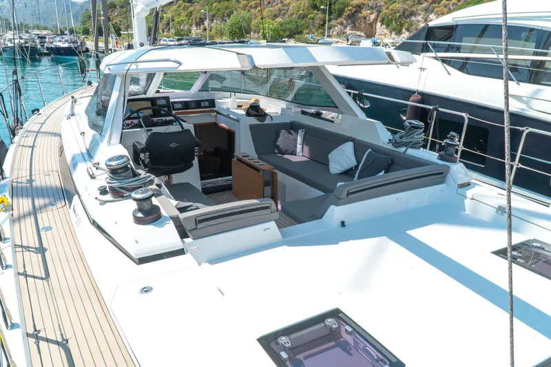  Yacht Photos Pics Luxurious 2018 Amel 50 yacht with spacious cockpit and modern design, docked in a scenic marina.
