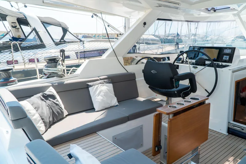  Yacht Photos Pics Luxurious 2018 Amel 50 yacht interior with plush seating and modern helm.