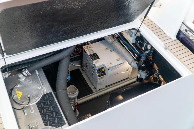  Yacht Photos Pics Engine compartment of a 2018 Amel 50 yacht, showcasing mechanical components and wiring.