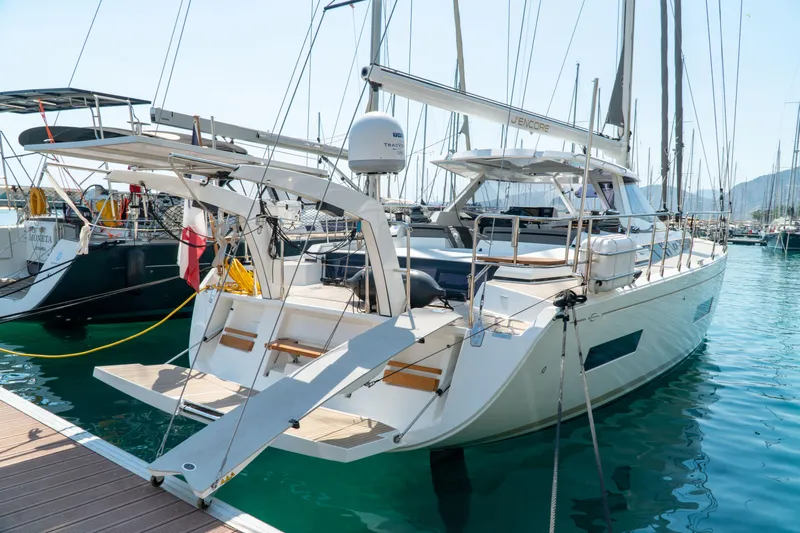  Yacht Photos Pics Sailing yacht Amel 50, 2018 model, docked in a marina with clear blue water.