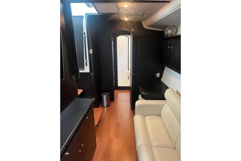 Queen Butterfly Yacht Photos Pics Interior of 2006 Lagoon 440 yacht with modern furnishings and wood flooring.