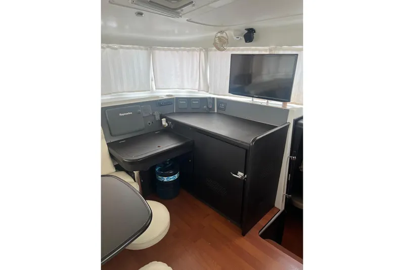Queen Butterfly Yacht Photos Pics Interior of 2006 Lagoon 440 yacht with navigation equipment and seating area.