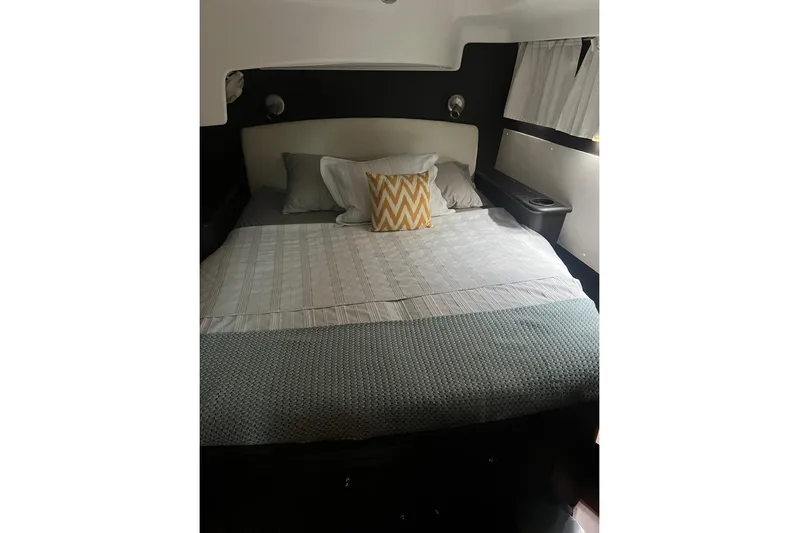 Queen Butterfly Yacht Photos Pics Cozy bedroom interior of 2006 Lagoon 440 yacht with stylish bedding and pillows.