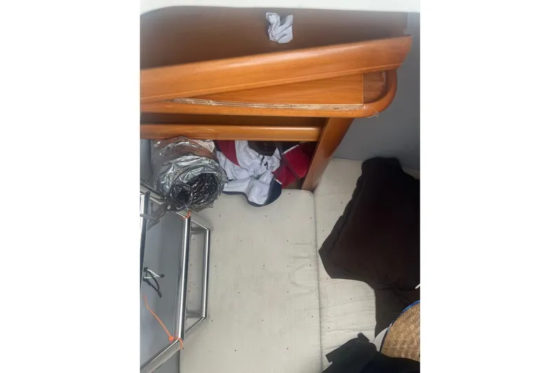 Queen Butterfly Yacht Photos Pics Interior of 2006 Lagoon 440 yacht with wooden cabinetry and storage area.