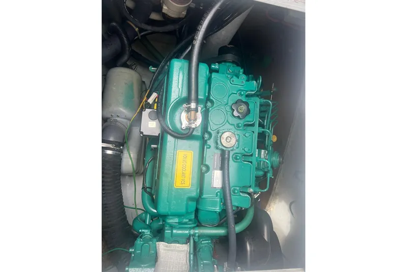 Queen Butterfly Yacht Photos Pics Engine compartment of a 2006 Lagoon 440 catamaran, featuring a Volvo Penta engine.