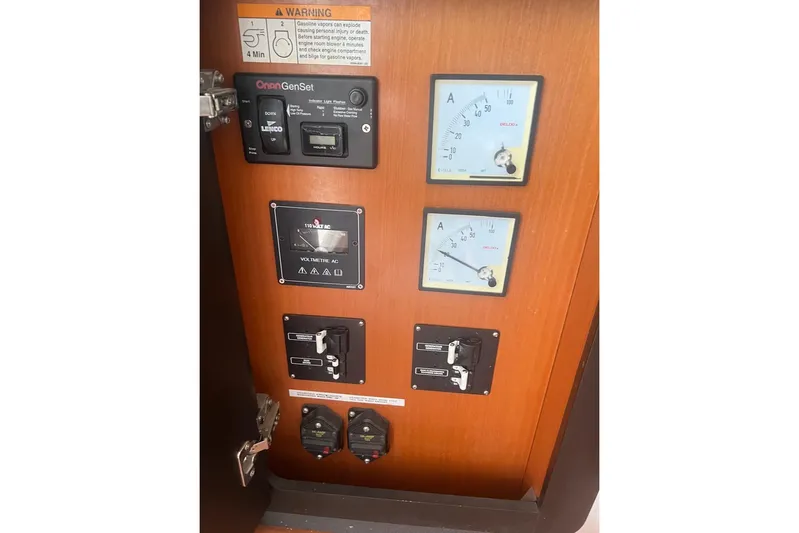 Queen Butterfly Yacht Photos Pics Electrical control panel on a 2006 Lagoon 440 boat with gauges and switches.