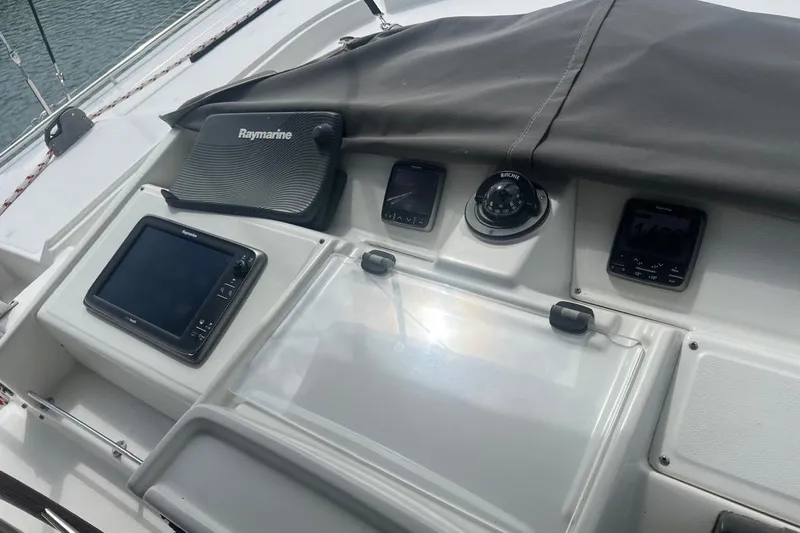 Queen Butterfly Yacht Photos Pics Control panel of a 2006 Lagoon 440 catamaran with navigation instruments.