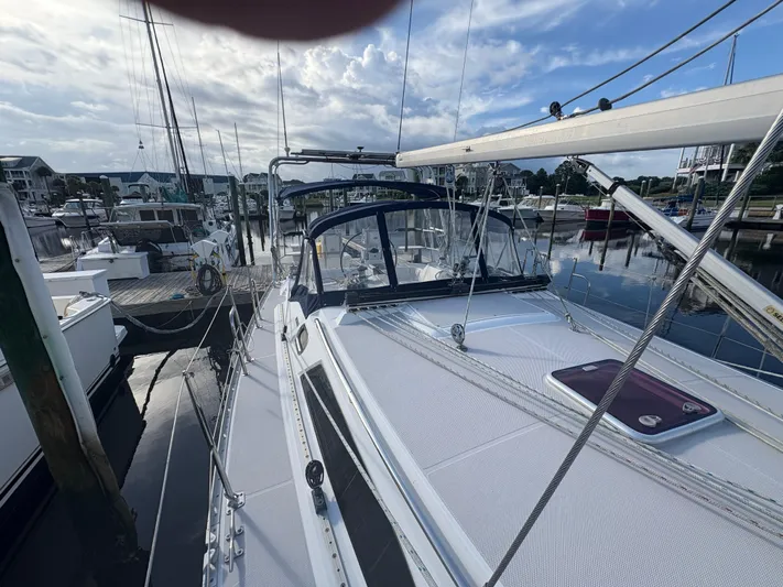 Carolina Wind Yacht Photos Pics Sailboat Catalina 355, 2011 model, docked at marina under a partly cloudy sky.