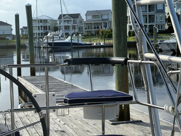 Carolina Wind Yacht Photos Pics Docked Catalina 355 sailboat, 2011 model, with waterfront homes in the background.