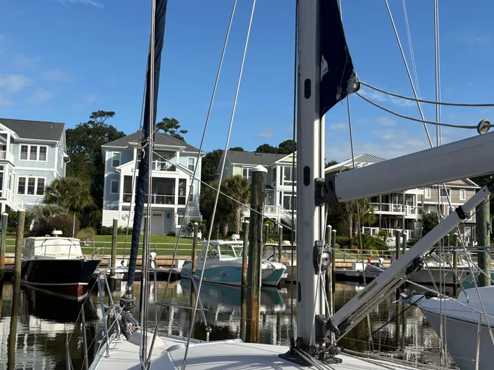 Carolina Wind Yacht Photos Pics Sailboat docked in marina with waterfront homes, Catalina 355, 2011 model.