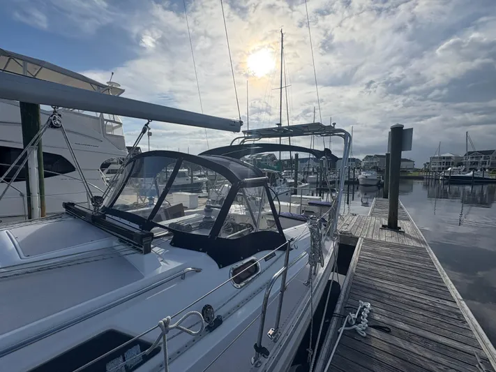 Carolina Wind Yacht Photos Pics 2011 Catalina 355 sailboat docked at marina under cloudy sky.