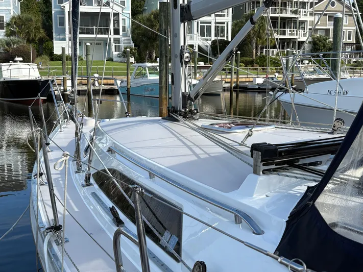 Carolina Wind Yacht Photos Pics Sailboat Catalina 355, 2011 model, docked in a marina with waterfront homes in the background.