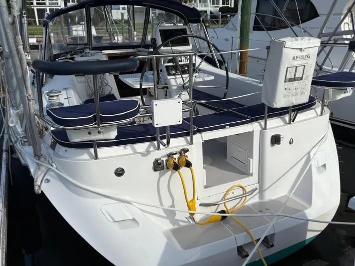 Carolina Wind Yacht Photos Pics 2011 Catalina 355 sailboat with blue seating, docked at marina.
