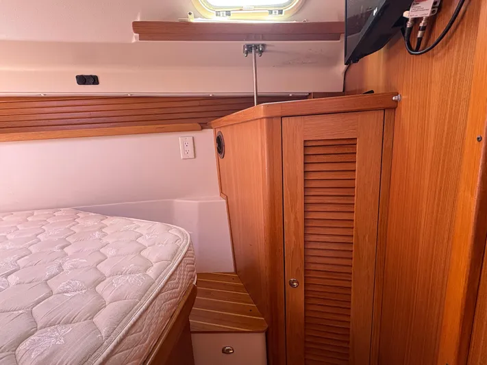 Carolina Wind Yacht Photos Pics Interior of 2011 Catalina 355 sailboat with wooden cabinetry and mattress.