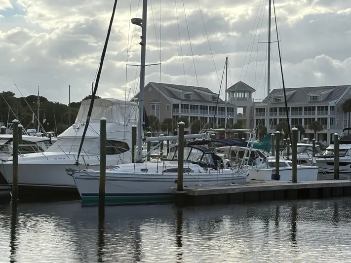 Carolina Wind Yacht Photos Pics Sailboats docked at a marina with a 2011 Catalina 355 in the foreground.