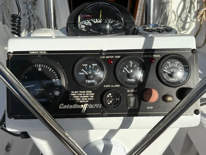 Carolina Wind Yacht Photos Pics Control panel of a 2011 Catalina 355 yacht, featuring gauges and switches.