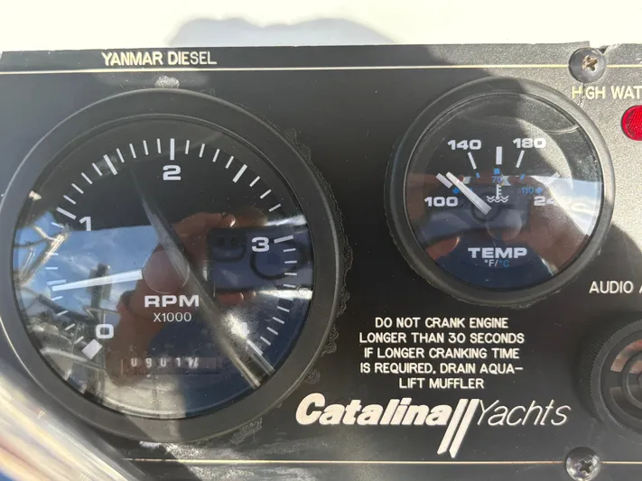 Carolina Wind Yacht Photos Pics Close-up of Catalina 355 yacht dashboard with RPM and temperature gauges.