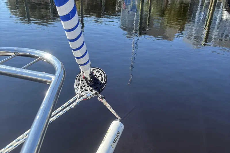 Carolina Wind Yacht Photos Pics Close-up of a Catalina 355 sailboat's bow and rigging over calm water.