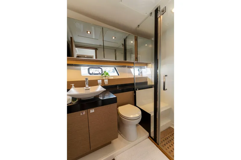 Seeworthy Yacht Photos Pics Luxurious bathroom in 2018 Prestige 560 yacht with modern fixtures and elegant design.