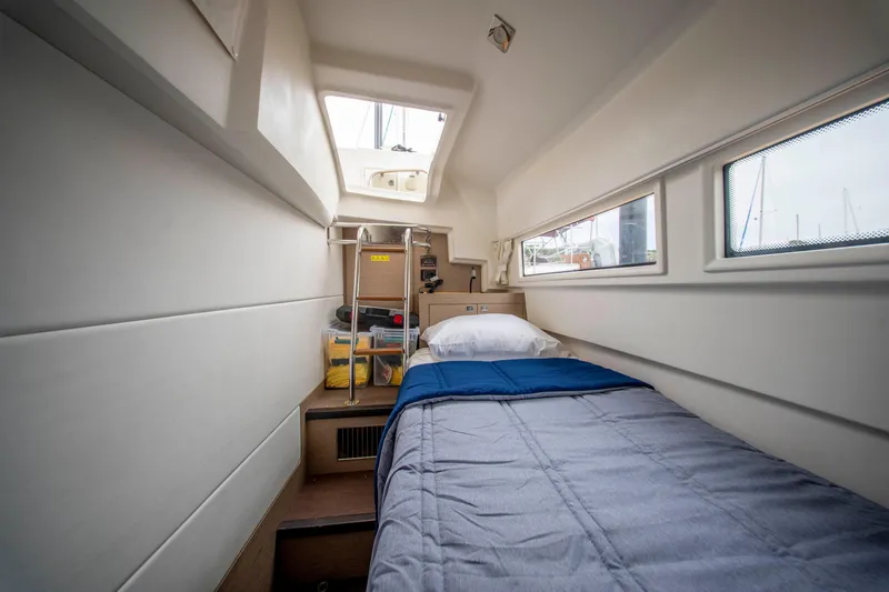 Seeworthy Yacht Photos Pics Cozy cabin interior of 2018 Prestige 560 yacht with single bed and windows.