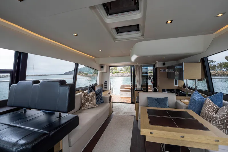 Seeworthy Yacht Photos Pics Luxurious interior of 2018 Prestige 560 yacht with elegant seating and scenic views.