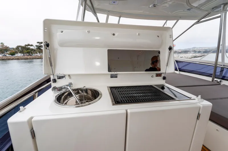 Seeworthy Yacht Photos Pics Outdoor kitchen on 2018 Prestige 560 yacht with sink and grill.
