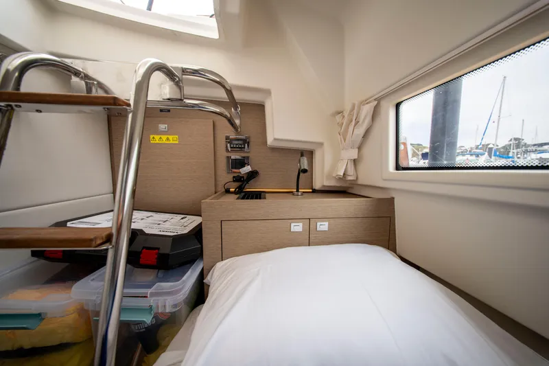 Seeworthy Yacht Photos Pics Cozy cabin interior of 2018 Prestige 560 yacht with bed, window, and storage.