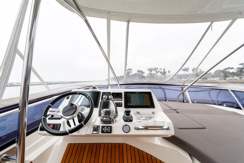 Seeworthy Yacht Photos Pics 2018 Prestige 560 yacht helm with modern navigation system and luxurious seating.