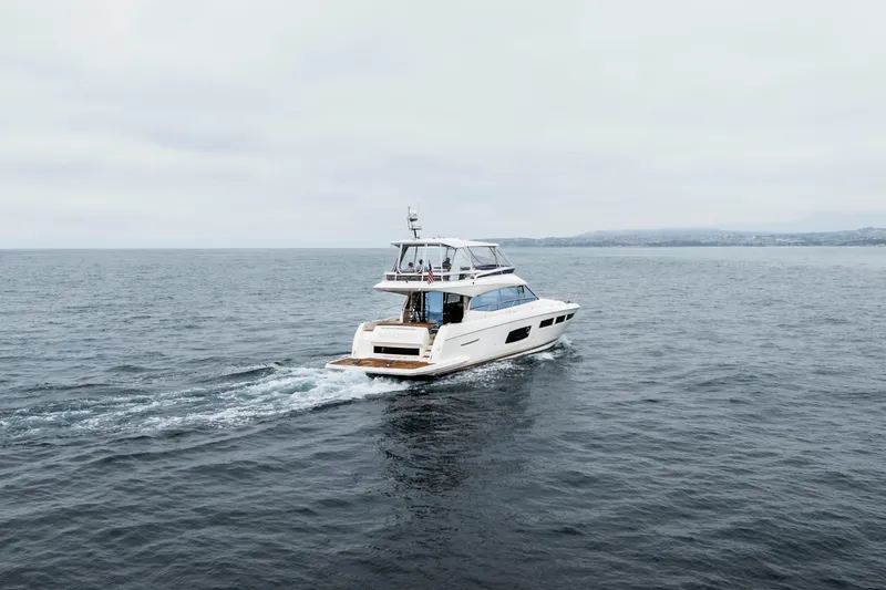 Seeworthy Yacht Photos Pics 2018 Prestige 560 yacht cruising on open sea under cloudy skies.