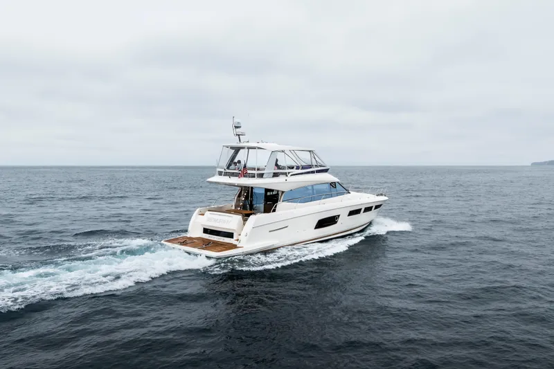 Seeworthy Yacht Photos Pics 2018 Prestige 560 yacht cruising on open sea under cloudy skies.