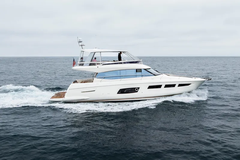 Seeworthy Yacht Photos Pics 2018 Prestige 560 yacht cruising on open sea under cloudy skies.