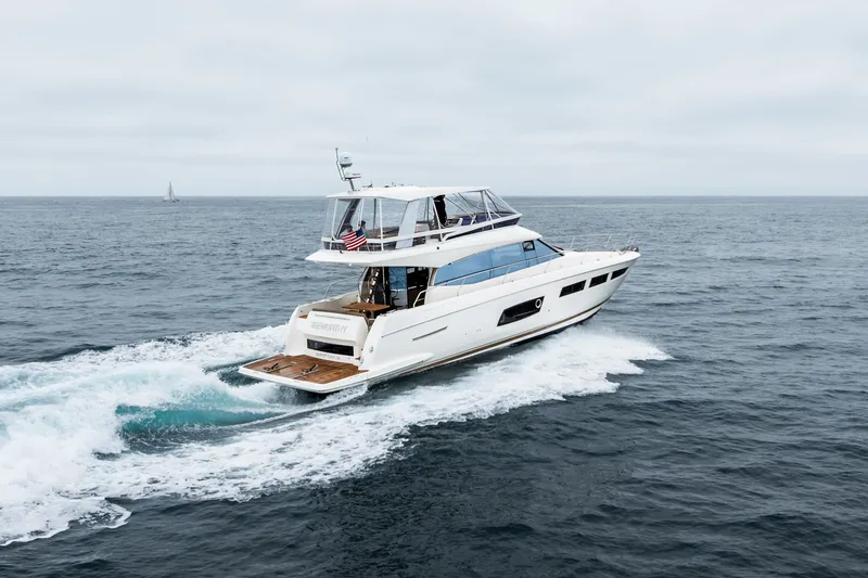Seeworthy Yacht Photos Pics Luxurious 2018 Prestige 560 yacht cruising on open sea, showcasing sleek design and elegance.