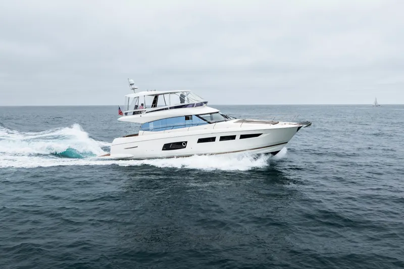 Seeworthy Yacht Photos Pics 2018 Prestige 560 yacht cruising on open sea under cloudy skies.