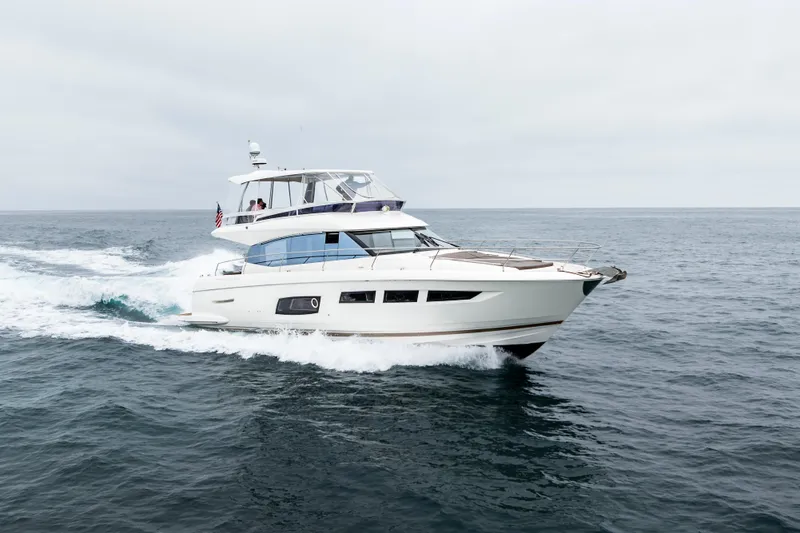 Seeworthy Yacht Photos Pics 2018 Prestige 560 yacht cruising on open sea under cloudy skies.