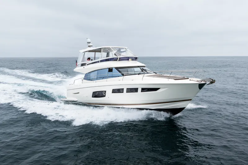 Seeworthy Yacht Photos Pics 2018 Prestige 560 yacht cruising on open sea under cloudy skies.