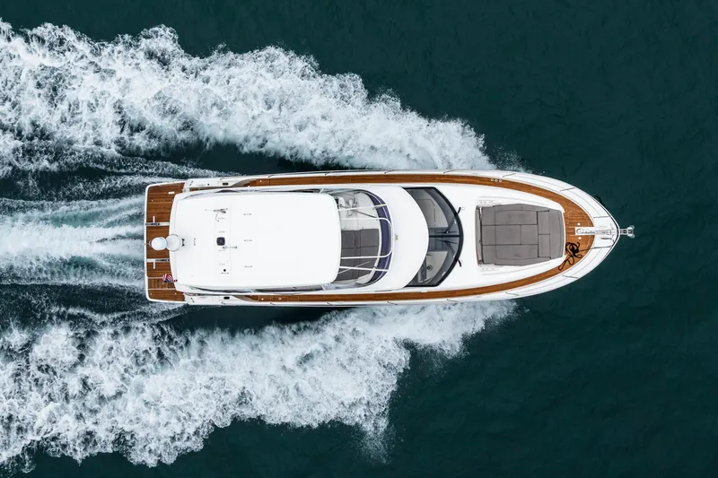 Seeworthy Yacht Photos Pics Aerial view of 2018 Prestige 560 yacht cruising on open water.
