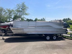 2020 G3 SunCatcher V322FC pontoon boat on trailer, parked outdoors.