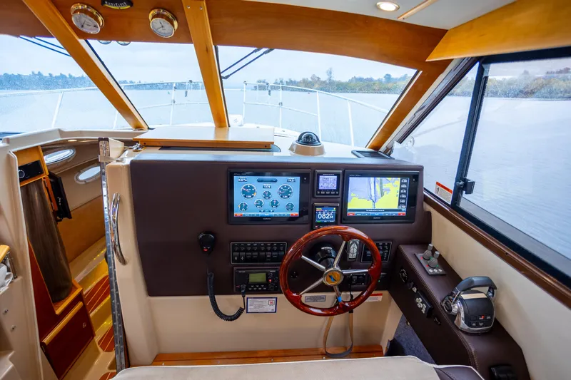 Halcyon Yacht Photos Pics Helm of 2016 Cutwater 30 CB boat with advanced navigation displays and controls.
