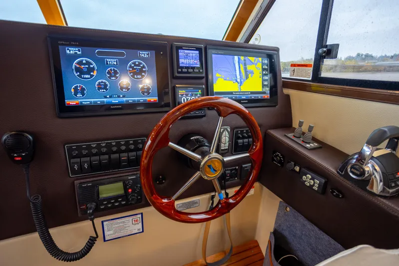 Halcyon Yacht Photos Pics Helm of 2016 Cutwater 30 CB boat with navigation and control systems.