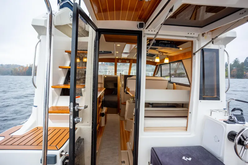 Halcyon Yacht Photos Pics Interior view of 2016 Cutwater 30 CB boat, featuring modern design and wood accents.